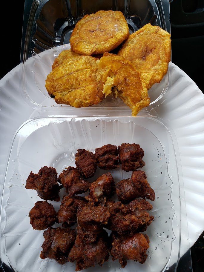 Dominican comfort food served on a simple table.
